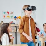 kids in a classroom using a VR headset